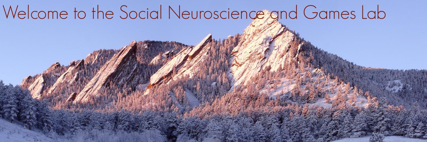 Snowy Flatirons with welcome text, "welcome to the Social Neuroscience and Games lab"