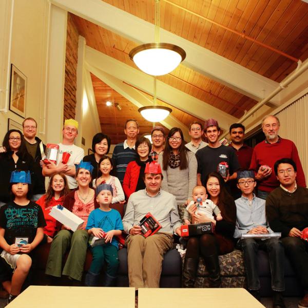 a group photo on the top of the Gamow tower during a holiday party in winter 2013