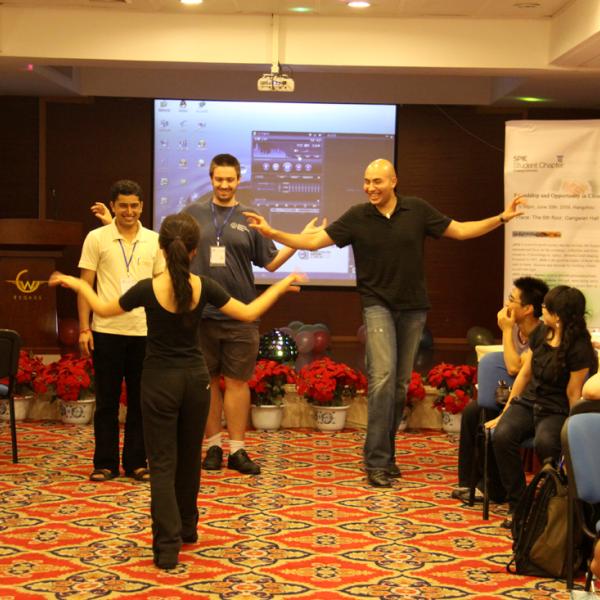 Julian Evans and Dennis Gardner are learning how to dance during the SPIE student chapters activities during I-CAMP 2009 in Hangzhou, China