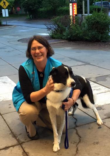 Frazier posing with her pup, Pacha, a certified therapy dog. The duo primarily visit with hospital patients to lend a sympathetic and calming presence while they are healing from injuries and surgeries. The duo have been working as team since 2013.