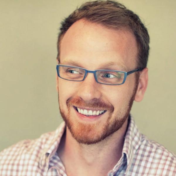 A square picture of Dr. Jed Brubaker, a white man with close cut brown hair and glasses.
