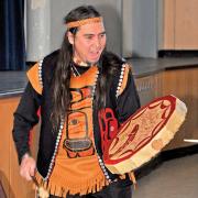 Alaska Native Bill Pagaran playing a hand drum