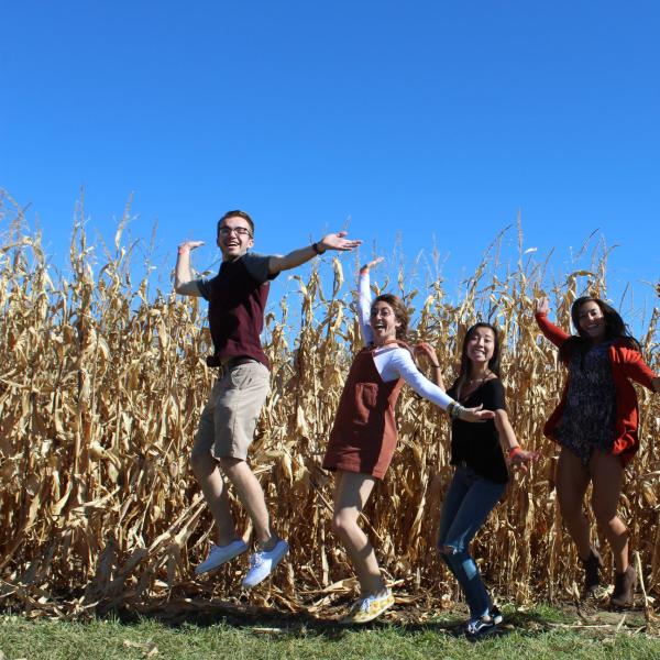 Group jumping photo at the pumpkin patch
