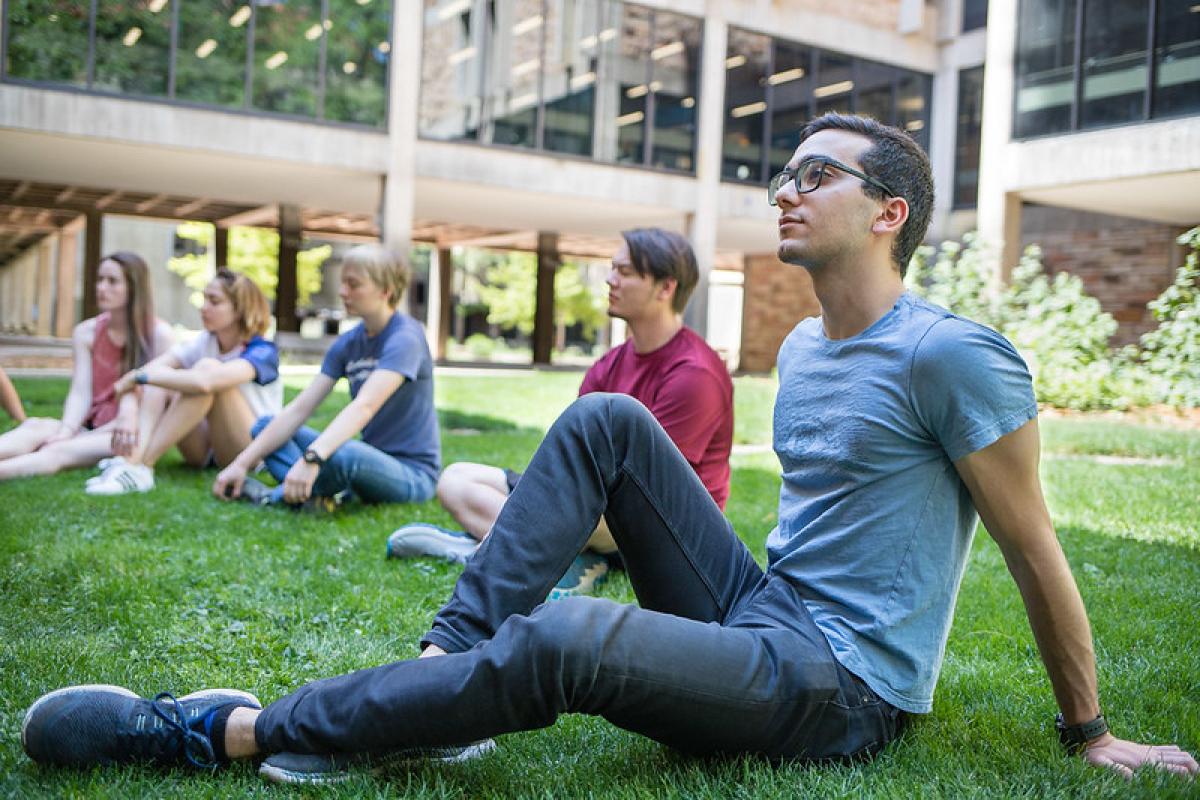 Students outside on grass