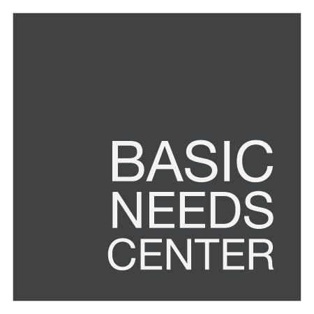 stylized text 'Basic Needs Center'