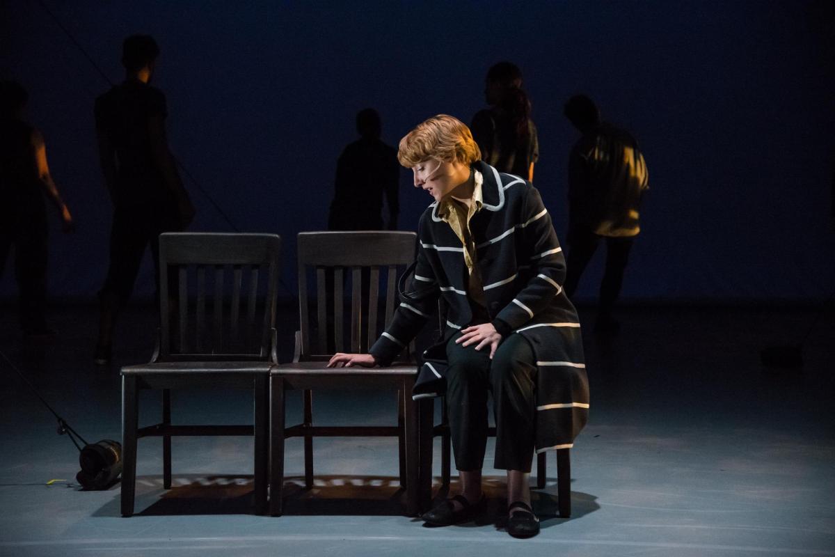 Female student singing during a performance