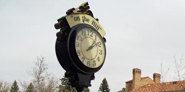 A clock that says "on the hill"