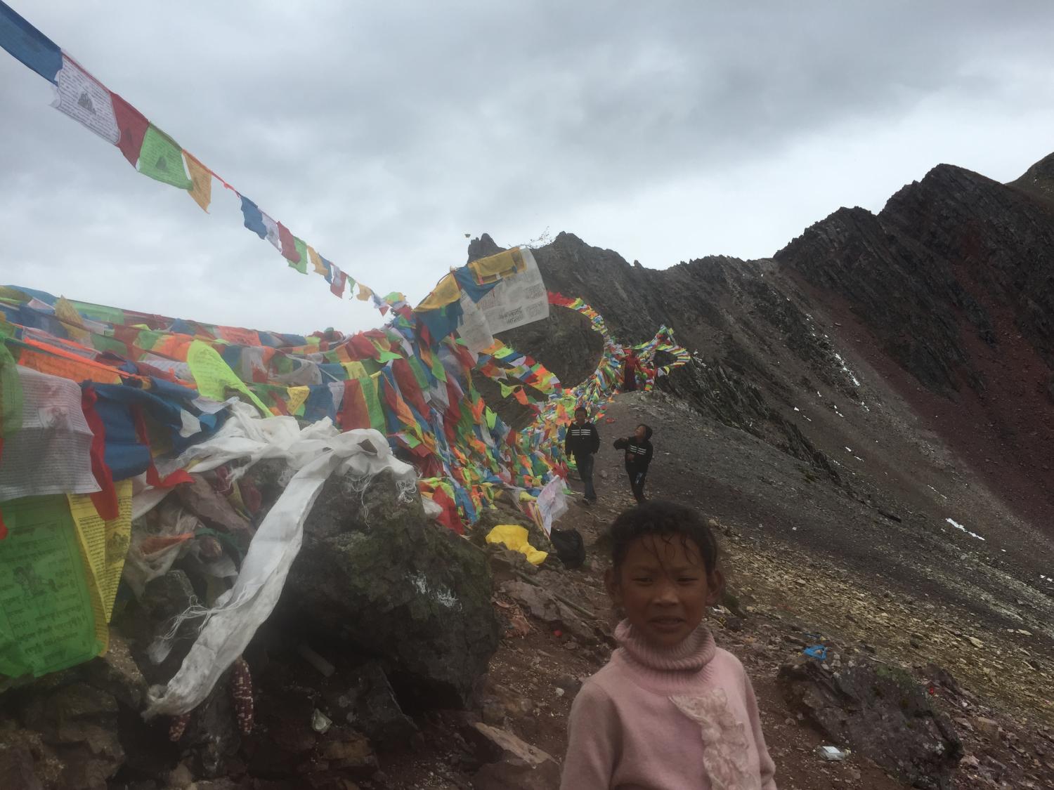 A young girl and two boys from Derong at the top of Shola. 