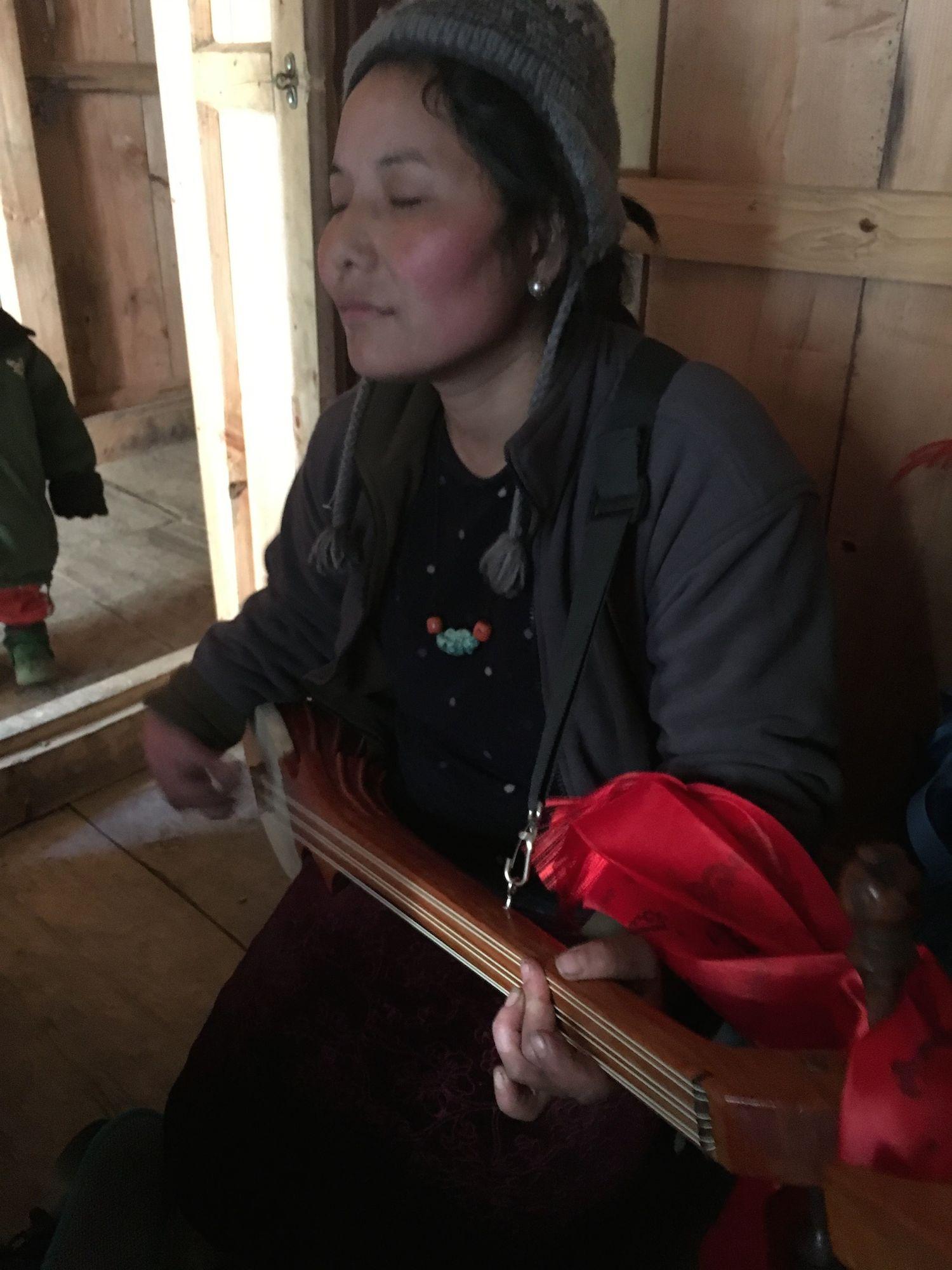 Dawa Lhamo plays the dranyen (Tibetan lute), Sho village.