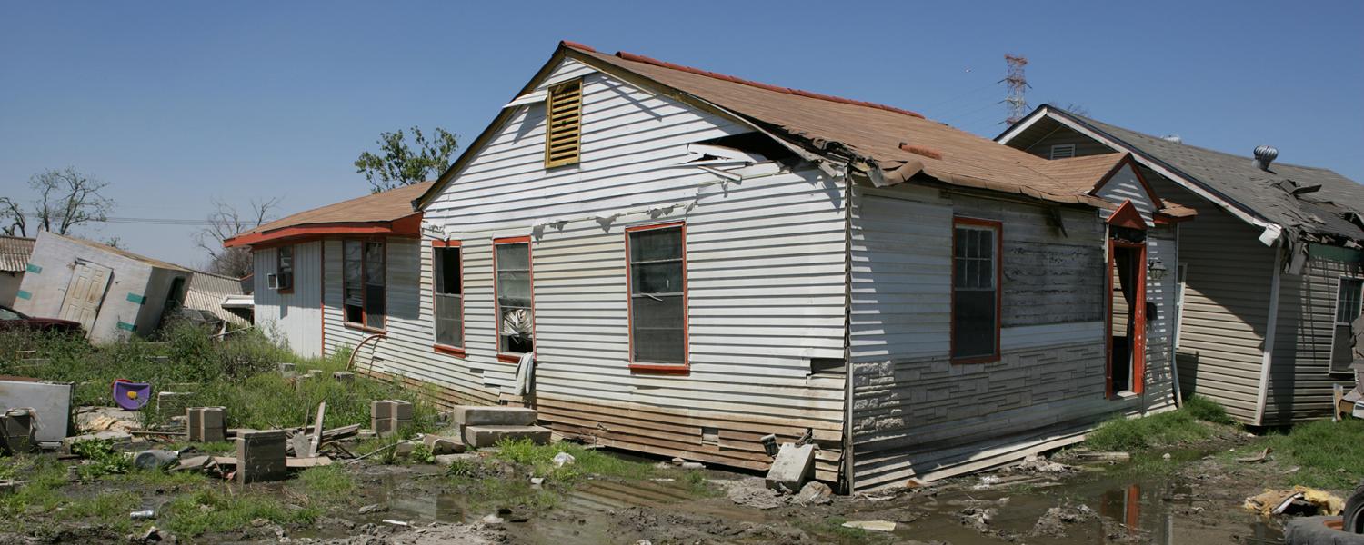 A house in Houston shows visible damage after flooding. 