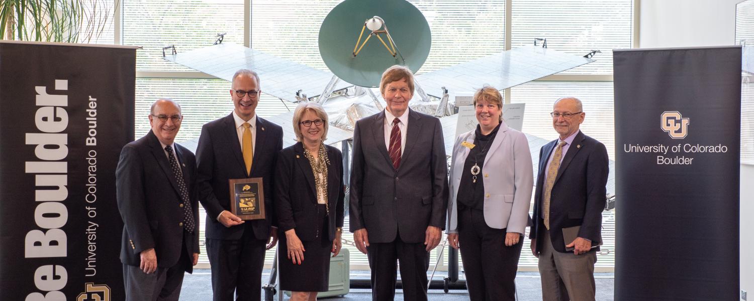 CU President Mark Kennedy, second from left, poses with CU and LASP leadership during a tour of CU Boulder’s Laboratory for Atmospheric and Space Physics (LASP) on July 1, 2019, Kennedy’s first official day on the job. From left, Chancellor Phil DiStefano; Kennedy, Debbie Kennedy, Mark’s wife; LASP director Dan Baker, Vice Chancellor for Research & Innovation Terri Fiez and Provost Russell Moore. (Photo by Glenn Asakawa/University of Colorado)