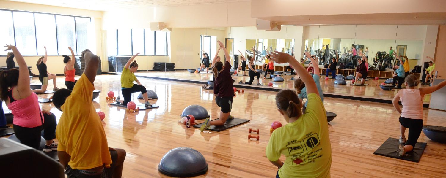 Students participate in fitness class at The Rec Center