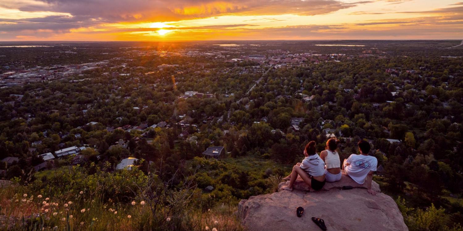 CU Boulder students watch sunset from Flagstaff Mountain