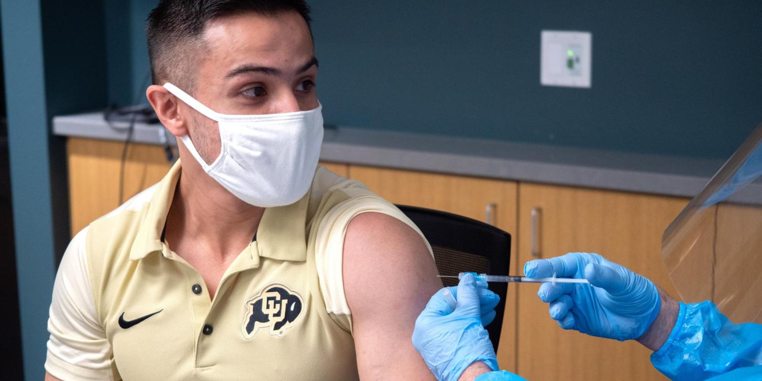 A student getting a vaccine