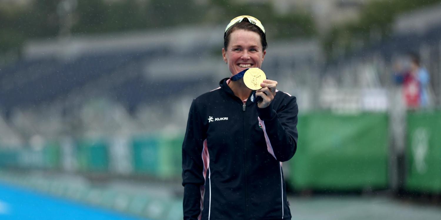 Flora Duffy, a former Buff, holds her Olympic Gold medal