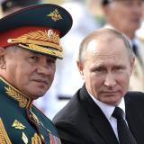 Vladimir Putin sits next to Sergei Shoigu