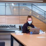 student wearing mask on campus