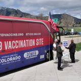 A mobile COVID-19 vaccination bus parks at the Williams Village residence complex at CU Boulder