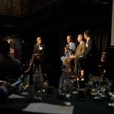 Panelists speak at a real estate event on campus