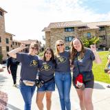 Volunteers pose for a photo during move-in