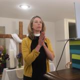 A pastor conducts online services from the basement of her home