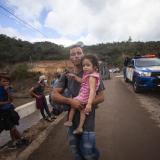 Migrants hoping to reach the distant U.S. border walk along a highway in Guatemala