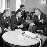 President Lyndon B. Johnson, right, talks with Martin Luther King Jr. and other civil rights leaders