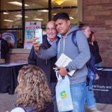 A student takes a selfie with Chancellor Phil DiStefano at the Health Hut event during the 2021 Health and Wellness Summit on the CU Boulder campus. (Photo by Glenn Asakawa/University of Colorado)