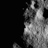An image of the lunar surface partially in shadow.