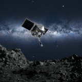 Artist's depiction of NASA's OSIRIS-REx spacecraft swooping toward Bennu to collect a sample of material from the asteroid's surface.
