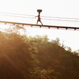 A person using a trail bridge in Rwanda