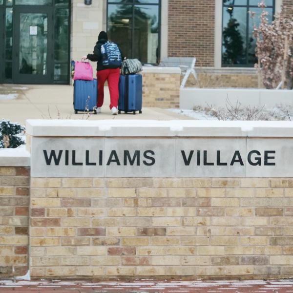 A student moves their belongings during Move-In Day on Feb. 8, 2021, at Williams Village at CU Boulder. (Photo by Casey A. Cass/University of Colorado)