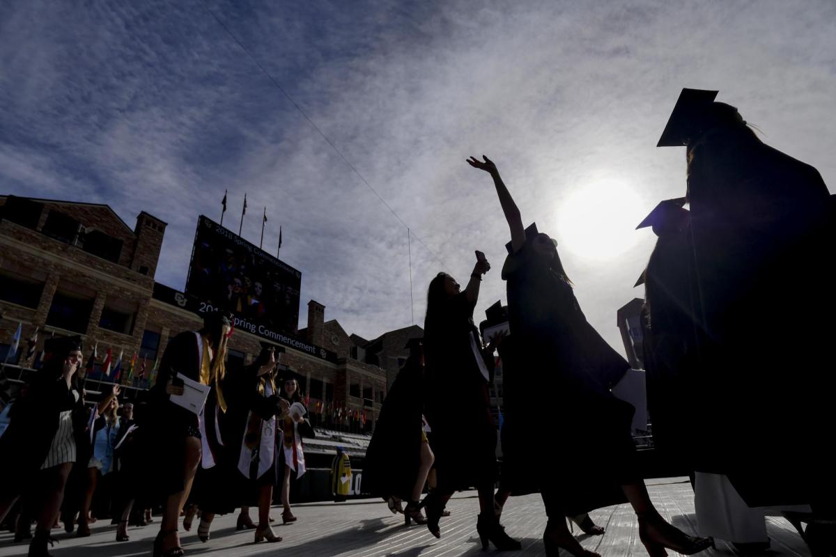 2018 graduates process onto Folsom Field