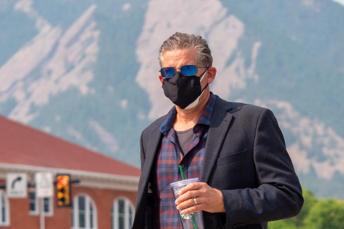 Man wearing two masks