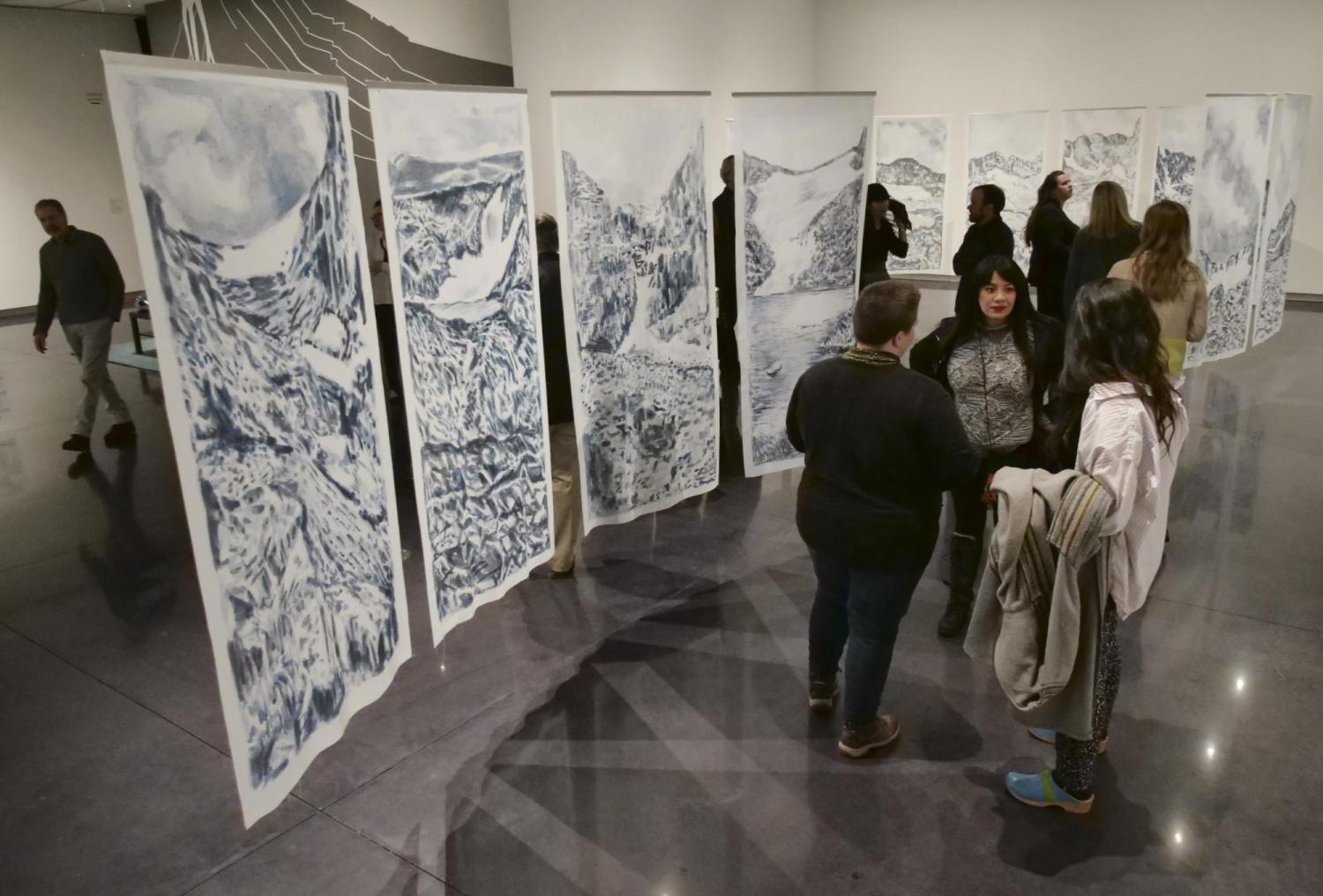 Attendees mingling at CU Art Museum exhibit