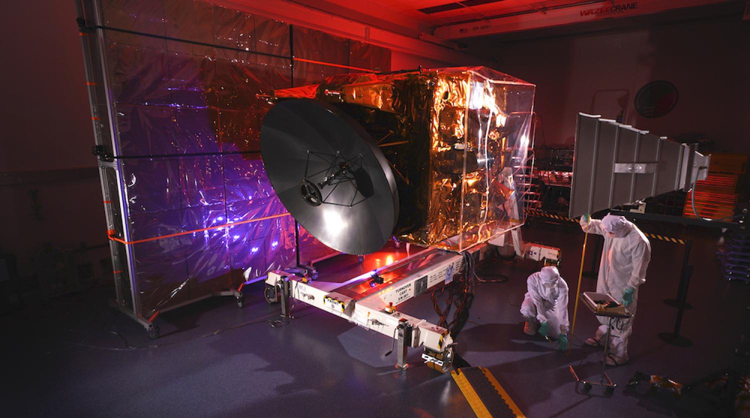 Engineers work on the EMM spacecraft in a cleanroom