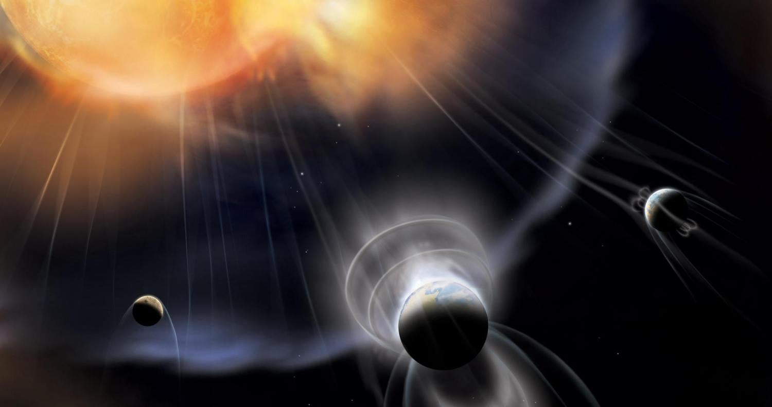 Illustration showing a sun with radiation impacting three planets surrounded by magnetic fields