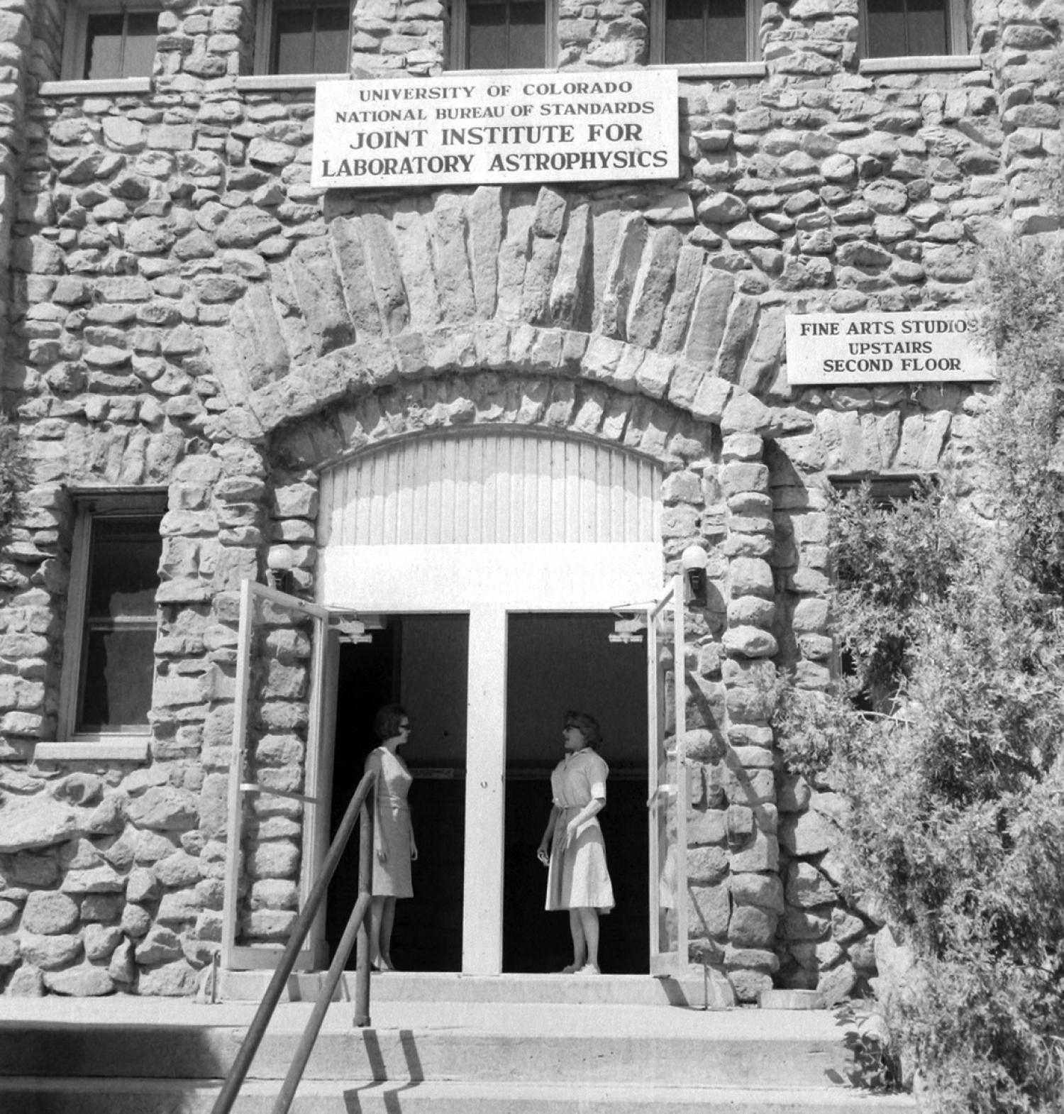 Two women stand at the door of the Join Institute for Laboratory Astrophysics