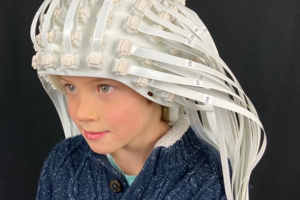 Child wears helmet made up of hundreds of sensors