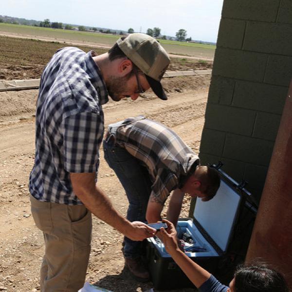 In 2014, then CIRES CU Boulder graduate students Jenny Nakai, Will Yeck and Matt Weingarten (right to left) set up a seismometer near the epicenter of the Greeley earthquake.