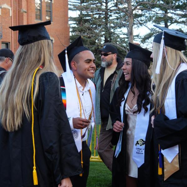 Students and faculty gather on the quad before processing to Folsom Stadium