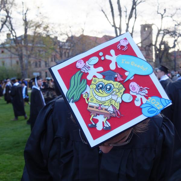 Students and faculty gather on the quad before processing to Folsom Stadium