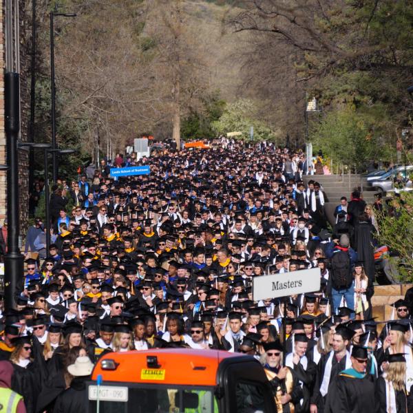 Commencement procession from Norlin Quad to Folsom Stadium