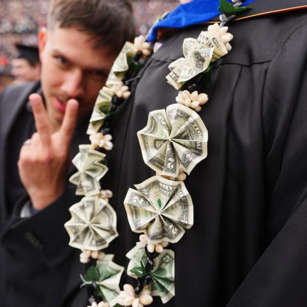 Graduate wears a money lei