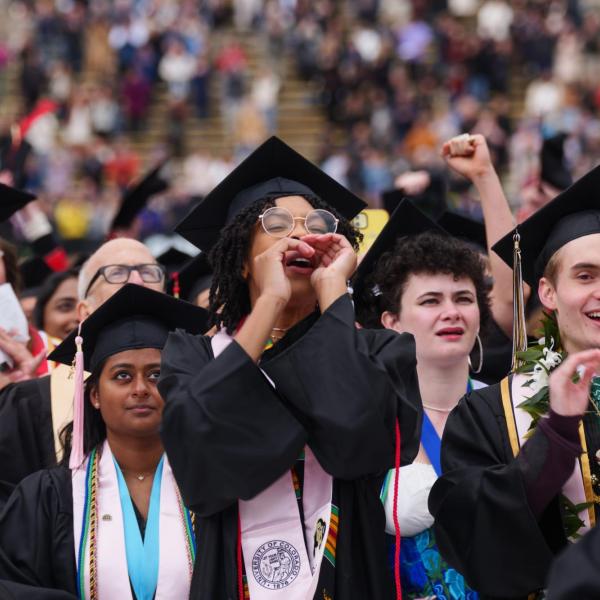 Graduates cheering during the commencement ceremony