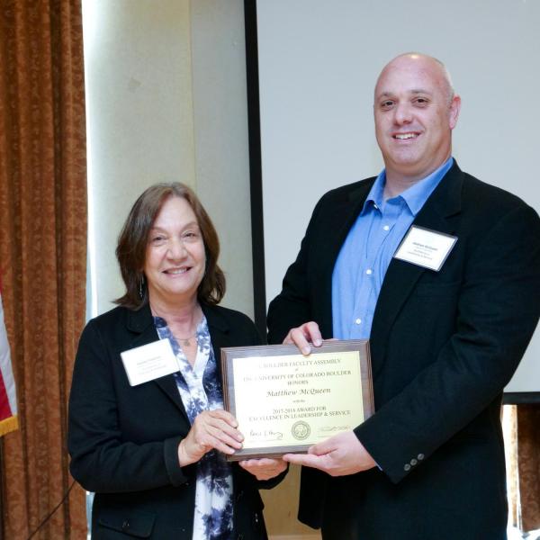 Leadership and Service Award Selection Committee Chair Andrea Feldman and recipient Matthew McQueen