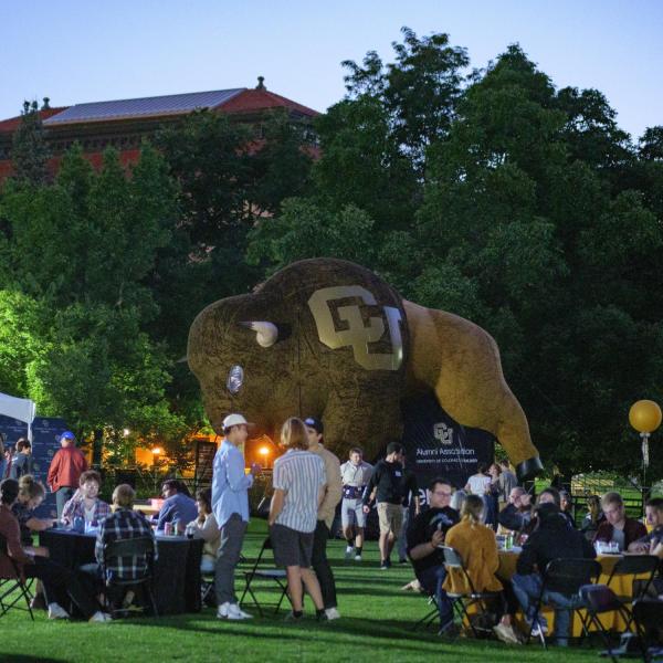 Graduates from the class of 2020 and 2021 gather for a celebratory evening at the Night on Norlin event on Sept. 17, 2021. (Photo by Glenn Asakawa/University of Colorado)