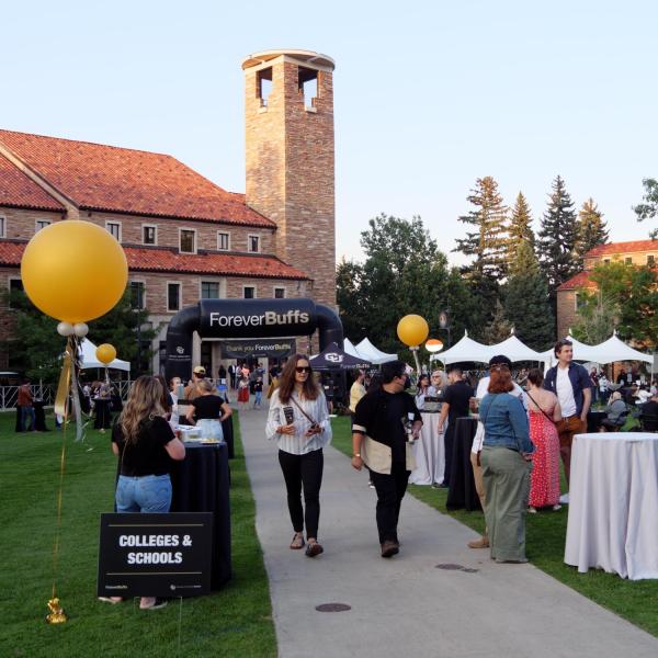 Graduates from the class of 2020 and 2021 gather for a celebratory evening at the Night on Norlin event on Sept. 17, 2021. (Photo by Glenn Asakawa/University of Colorado)