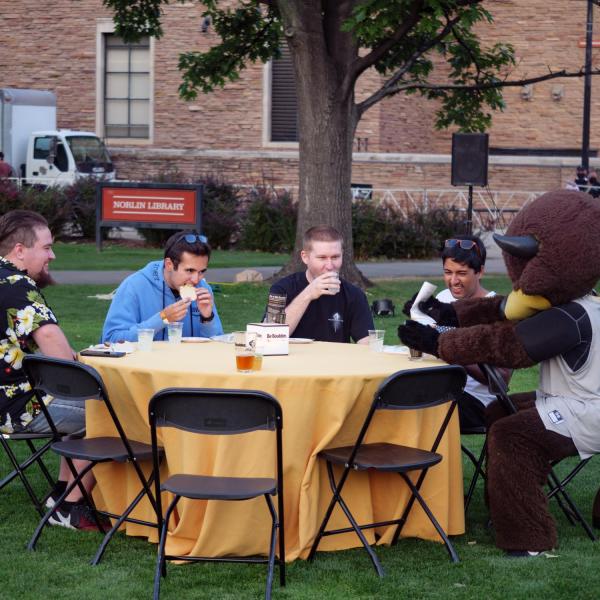 Graduates from the class of 2020 and 2021 gather for a celebratory evening at the Night on Norlin event on Sept. 17, 2021. (Photo by Glenn Asakawa/University of Colorado)