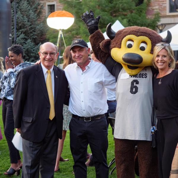 Chancellor Philip DiStefano, Dan Carlin and Chip meet at the Night on Norlin event on Sept. 17, 2021. (Photo by Glenn Asakawa/University of Colorado)